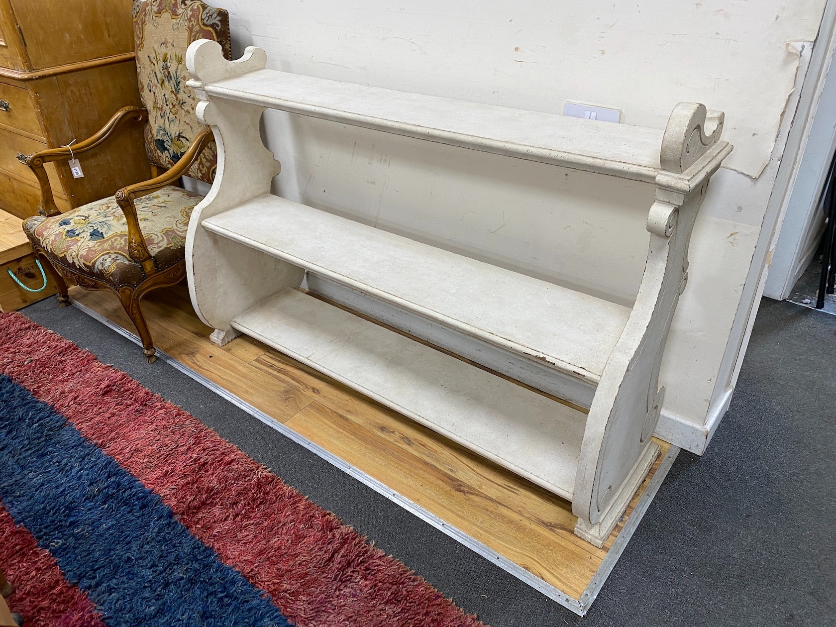 A pair of Victorian painted open bookcases, length 156cm, depth 46cm, height 102cm